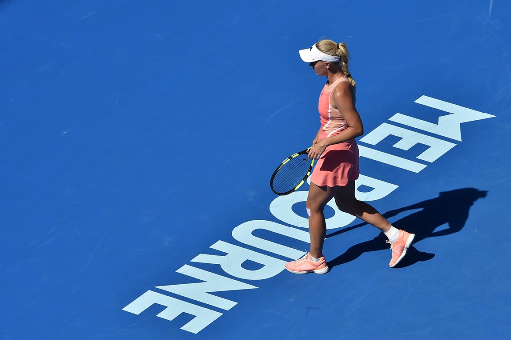 Denmark's Caroline Wozniacki walks on the court as she plays against Kazakhstan's Yulia Putintseva during their women's singles match on day one of the 2016 Australian Open tennis tournament in Melbourne on January 18, 2016. AFP PHOTO / PAUL CROCK-- IMAGE RESTRICTED TO EDITORIAL USE - STRICTLY NO COMMERCIAL USE / AFP / PAUL CROCK