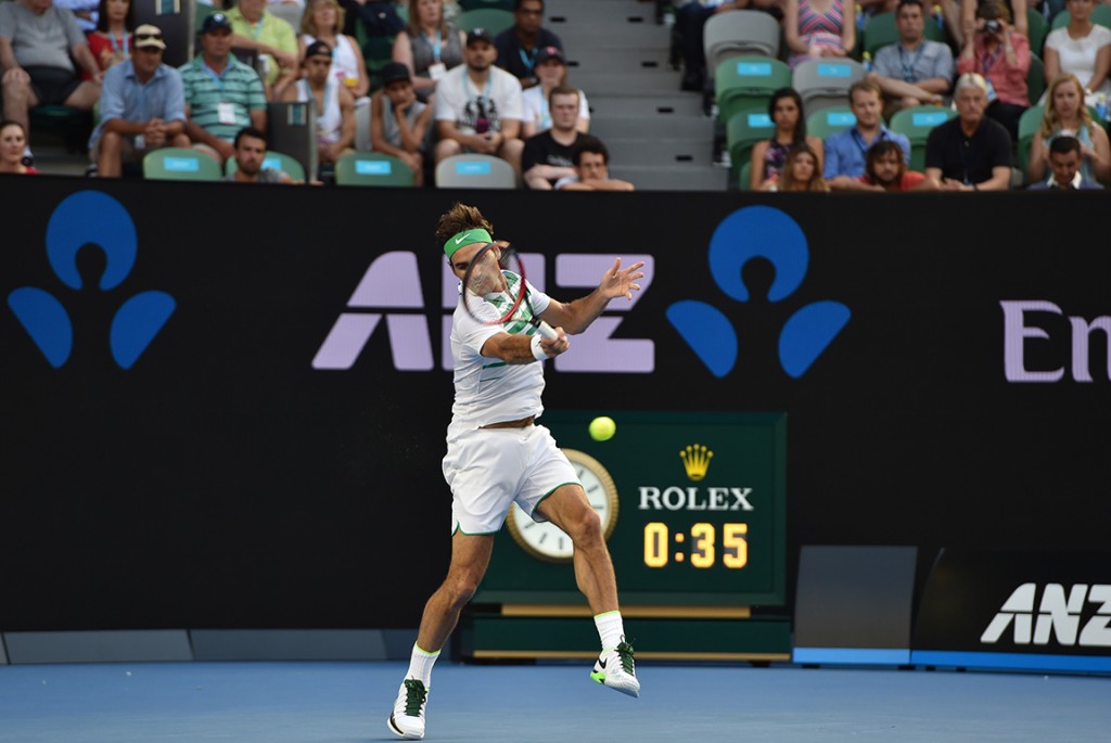 Switzerland's Roger Federer plays a forehand return during his men's singles match against Georgia's Nikoloz Basilashvili on day one of the 2016 Australian Open tennis tournament in Melbourne on January 18, 2016. AFP PHOTO / SAEED KHAN-- IMAGE RESTRICTED TO EDITORIAL USE - STRICTLY NO COMMERCIAL USE / AFP / SAEED KHAN