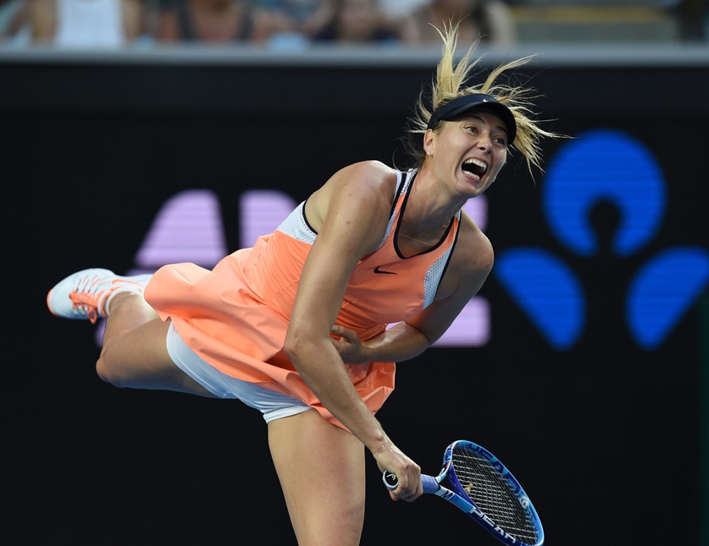 Russia's Maria Sharapova serves during her women's singles match against Japan's Hibino Nao on day one of the 2016 Australian Open tennis tournament in Melbourne on January 18, 2016. AFP PHOTO / GREG WOOD-- IMAGE RESTRICTED TO EDITORIAL USE - STRICTLY NO COMMERCIAL USE / AFP / GREG WOOD
